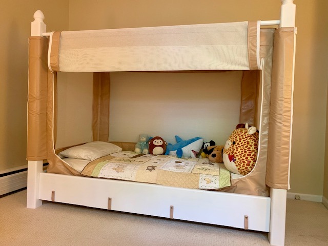 The patented Noah's World Autism Sleep Bed, hand-built and shown with stuffed animals